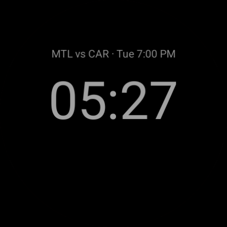The watch face in always-on mode: black background, time and next game